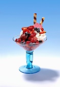Strawberry ice cream with strawberries, wild berries and cream