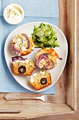 Greek-style muffins, with herbs, olives, feta and red onions