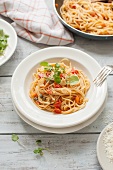 Spaghetti with tomatoes, garlic, capers and fresh watercress