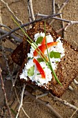 Herby goat's cheese with pepper on wholemeal rye bread