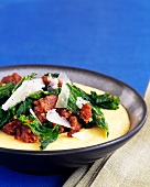 Soft Polenta Topped with Ground Pork, Kale and Shaved Parmesan Cheese