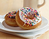Two Doughnuts with Vanilla and Chocolate Icing and Sprinkles