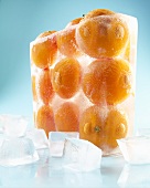 Whole Oranges Frozen in a Block of Ice