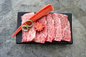 Thinly sliced raw Wagyu beef for teppanyaki