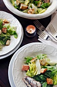 Caesar Salad with Sardines in Bowls; From Above