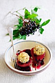 Pears poached in red with with cream cheese balls