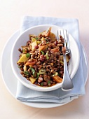 Lentil salad with bacon, carrots and potatoes
