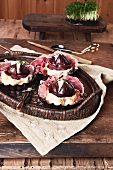 Figs cooked in cake batter with dry-cured ham and cream cheese