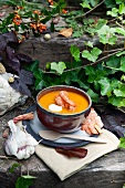 Spicy pumpkin soup with curry, prawns and a blob of yoghurt