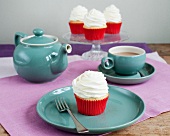 Cupcakes topped with icing, and a coffee set