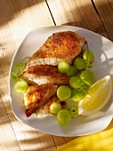 Chicken breast with cucumber balls and lemon