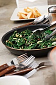 Cooked spinach with raisins and pine nuts