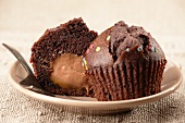 A filled chocolate muffin decorated with edible confetti