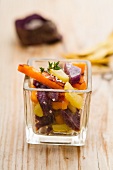 Steamed potatoes and sweet potatoes in a square glass