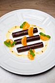 Chocolate rolls with mandarin segments