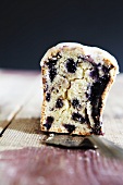 A slice of blueberry cake on a cake slice