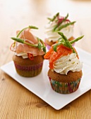 Savoury cupcakes topped with salmon, cured ham and asparagus