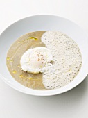 Cream of lentil soup with a poached egg and frothy milk