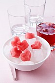 Heart-shaped ice cubes made from fruit juice