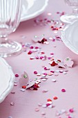Confetti & paper butterflies decorating table