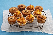 Assorted muffins topped with banana and nuts