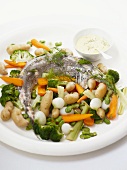 Fish with colourful vegetables and dip