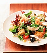 Chicken salad with herb croutons and olives