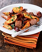 Fried sausage with potato wedges and Cumberland sauce