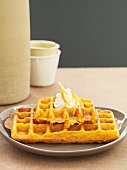 Carrot waffles with a blob of cream
