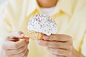 Man holding cupcake