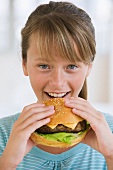 Girl eating hamburger