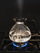 Close up of water boiling on stove