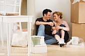 Couple drinking wine in new house