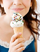 Teenage girl eating ice cream cone