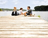 Couple laying on dock