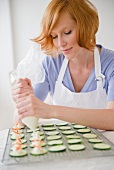 Young woman preparing appetizers