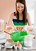 Young woman preparing food in kitchen