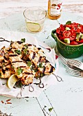 Chicken skewers with tomatoes and avocado salsa