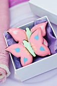 Two pink 'butterfly' cookies for gifting