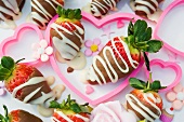 Chocolate dipped strawberries in pink hearts with sugar flowers