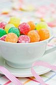Colorful jelly candies in a tea cup