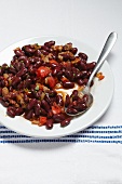 Chili con carne on a plate with a spoon