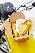 Cheese sandwiches in a cardboard box