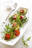 Rocket salad with tomatoes and avocado