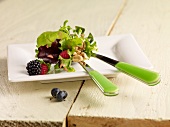 Green salad with berries and walnuts