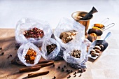 Assorted spices, some in plastic bags