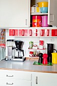 Colourful kitchen utensils in kitchen