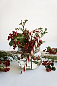 Posy of holly berries and candy cane