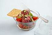 Beef tartar with tomatoes and basil