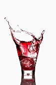 Campari spilling out a glass